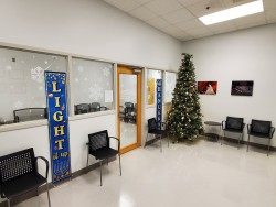 Image of Dr. Mark Brown's clinic exterior showing the building entrance with signage, clinic logo, and office hours displayed on the door.