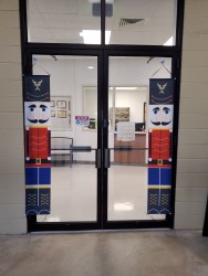Image of Dr. Mark Brown's clinic exterior showing the building entrance with signage, clinic logo, and office hours displayed on the door.