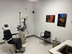Image of Dr. Mark Brown's clinic exterior showing the building entrance with signage, clinic logo, and office hours displayed on the door.