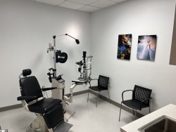 Image of Dr. Mark Brown's clinic exterior showing the building entrance with signage, clinic logo, and office hours displayed on the door.